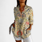 Nööpide ja lilleprindiga pluss