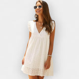 Vestido de verão com calções embutidos e bolsos.