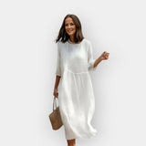 Um vestido com uma cobertura favorecedora na zona da barriga.